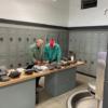Welding Instructor, Aaron Schmitt (left) teaching a welding student. 