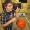 Animal Health student practicing suturing skills on a pumpkin. 
