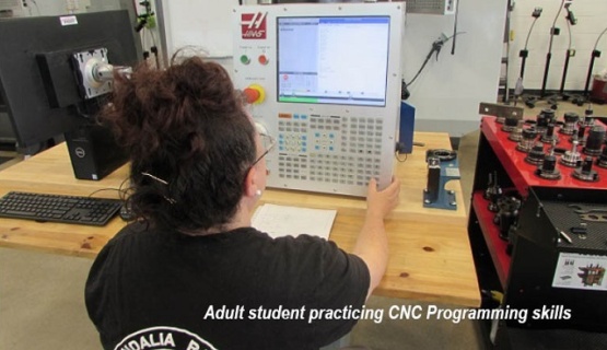 Summer adult student learning CNC programing. 
