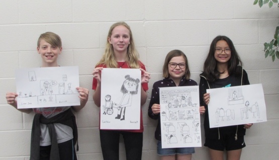 Four notepad contest winners with their winning drawings. 