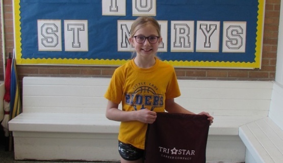Notepad contest winner Kaylee Klosterman with her prize goodie bag. 