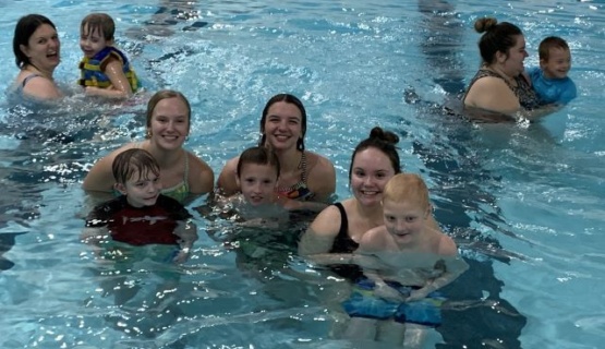 Teacher Education students in the pool with their swimming buddies. 