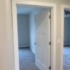 Front hall with large closet leads to main bathroom and bedrooms (three total bedrooms).: Gallery Image 4 