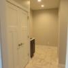 Laundry room with closet and sink just inside the entrance from the garage.  Also includes a half-bath.: Gallery Image 1 