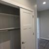 Front hall with large closet leads to main bathroom and bedrooms (three total bedrooms).: Gallery Image 3 