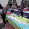 Participants hard at work painting their wooden porch bunny.: Gallery Image 2 