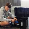 Adam Faber at work on his solar powered generator.: Gallery Image 1 