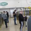 The adult FANUC robotics students practice programming their robots.: Gallery Image 1 