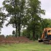 Heavy equipment begins the work of digging for the basement of the Stoker's new home.: Gallery Image 1 