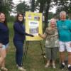 (on left) Andrea AbouJaoude and Nicole Rembacki H Eyne accept a donation check from Rod and Barb Carpenter.: Gallery Image 1 