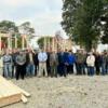 Junior construction students, Cornerstone Chapel Committee members, Mercer County Fair Board members, and the Mercer County Commissioners pose for a group photo outside the building site.: Gallery Image 1 