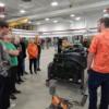 Ag. Industrial Tech. students (rt.) demonstrate how an engine works to Minster eighth graders (lft.) 