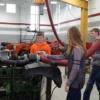 Unknown Minster 8th grade student revs the engine in the Ag. Industrial Tech. classroom. 