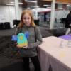 An attendee shows off her completed chick.: Gallery Image 2 