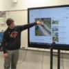 Tri Star Engineering student explaining his project design.: Gallery Image 9 