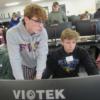 A Tri Star engineering senior (left) is watching over a sophomore as he works with CAD software.: Gallery Image 1 
