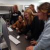 Fort Recovery 8th graders writing on a pressure tablet in Interactive Media: Gallery Image 1 