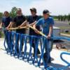 Tri Star welding students with the fish shaped bike rack they welded for the Celina community.  See them out on Grand Lake. 