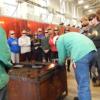 Tri Star welder demonstrating his welding skills for a group of 8th/9th graders on tour. 
