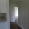 Hall behind kitchen leads to two bedrooms: Gallery Image 1 