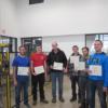 The most recent adult robotics class show the FANUC certificate they earned. 