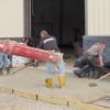 Junior construction students wade in and work the concrete.: Gallery Image 1 