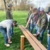 Construction students putting together obstacles at the dog park.: Gallery Image 1 