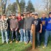 Junior construction students pose at the dog park after installing obstacles.: Gallery Image 1 