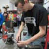 Junior auto tech student working on small engines 