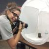 Student working on a close-up photography shoot. 