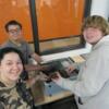 A trio of students enjoying their cybersecurity project. 