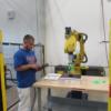 Student practicing with a FANUC robot.: Gallery Image 1 