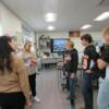 Med Prep students explain to some 8th graders how a piece of equipment is used.: Gallery Image 1 