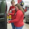 An 8th grader tries tightening a lugnut in the Auto Tech lab.: Gallery Image 1 