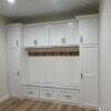 Mudroom storage, hooks for hanging, and bench with storage drawers.: Gallery Image 1 