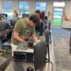 Instructor Mike Eilerman helping students as they rebuild their computers.: Gallery Image 1 