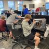 IT Cybersecurity students hard at work on their computers.: Gallery Image 1 