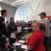 A Lincoln Electric employer shares information about  job opportunities with some students.: Gallery Image 1 