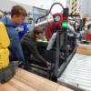 Marion Local 8th grader works the industrial robot with a wave of his hand in REC Tech.: Gallery Image 1 