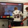 A Tri Star student from Minster helps a visiting Minster student try out the virtual welder in welding.: Gallery Image 1 