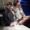 A New Bremen 8th grader tries soldering in REC Tech.: Gallery Image 1 