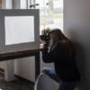 Olivia uses her light box to photo graph a product.: Gallery Image 1 