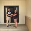 Tim hands Pam Rasawehr the keys to her new home.: Gallery Image 1 