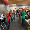 Staff serving students breakfast and enjoying the food and fellowship.: Gallery Image 1 