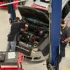 Mason is pictured working on an engine during the Auto Service Technology competition.: Gallery Image 1 