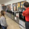Taylor Hesse learning about her new 3D printer from Chad Whited.: Gallery Image 1 