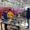Welding student discuss weld tests.: Gallery Image 1 