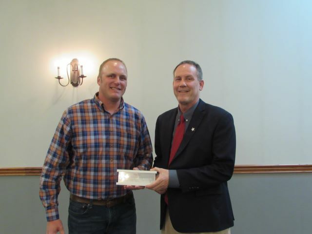 Coldwater Young Farmer, Dusty Uhlenhake, accepting an award from Director Tim Buschur.: Featured Image 1 