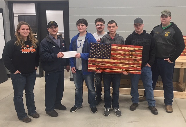 Junior construction students present Lee Braun a donation check.: Featured Image 1 