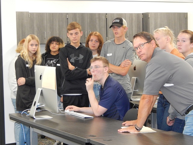 New Knoxville students and chaperone at a station in the Interactive Media classroom.: Featured Image 1 